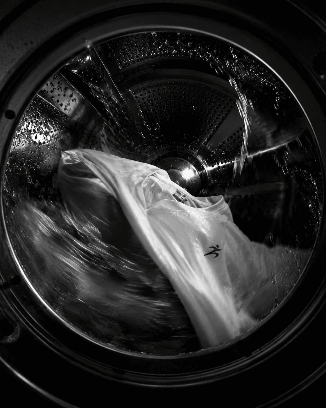 A Malin garment mid-cycle inside a washing-machine drum